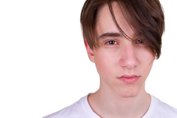 Teen boy  looking at camera. Closeup portrait of a handsome man, isolated on white background