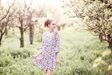 Fototapeta na wymiar Stylish girl wearing summer dress posing outdoors.