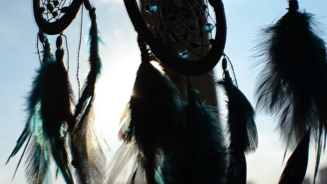 Dream catcher handmade with feathers threads and beads.