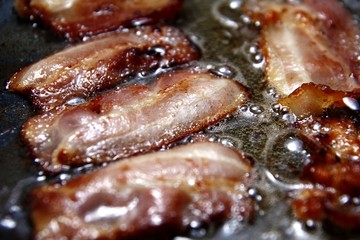 Fried bacon in a pan