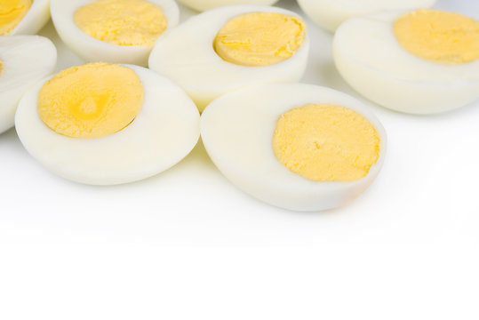 Boiled egg sliced on white background