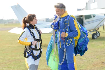 Fototapeten safety landing for the skydivers © auremar