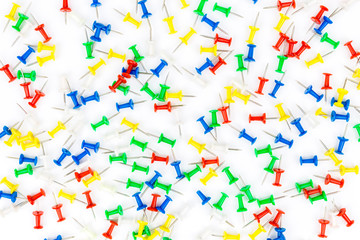 Fototapeta na wymiar Set of push pins in different colors. frame of thumbtacks on white. Top view.Push pins isolated on white background. colourful push-pin thumbtack tools office on white background