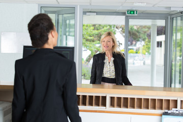 woman administrator and the client on the visitor reception