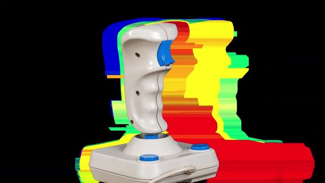 a retro computer arcade game joystick spinning 360 degrees. this version has intentional overlayed video distortion and glitch effects