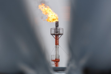 torch at oil refinery, oil pipeline