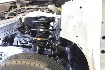 cross section of car show suspension system ; automotive industry background