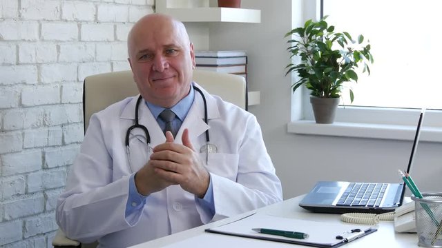Doctor in Medicine Cabinet Looking to Camera Smile and Make Nervous Gestures