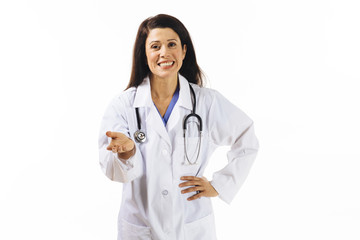 Portrait of a  smiling female doctor gesturing at camera, isolated on white studio background
