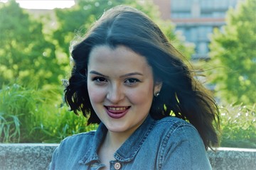 portrait of a young, sexy girl, who puts out her tongue gently