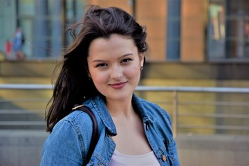 beautiful young elegant woman in the city