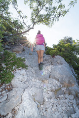 Naklejka premium Italy, Sardinia, Baunei - Woman doing trekking