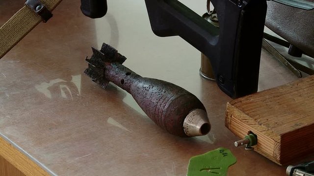 military instructor shows weapons and explosives