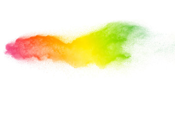 Multi color powder explosion on white background. Launched colorful dust particles splashing.