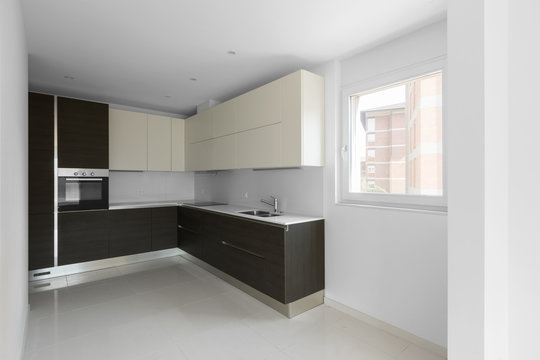 Dark minimal kitchen in a modern apartment