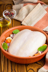Cooking dinner, chicken breast with skin and vegetables for baking in the oven