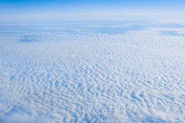 Fototapeta na wymiar clouds from airplane window