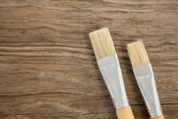 Flat brushes on wooden surface