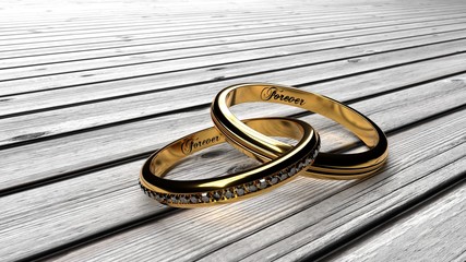 Golden wedding rings joined together with engraved word 'Forever', symbolize marriage bond, loyalty in relationship, macro close up. - obrazy, fototapety, plakaty