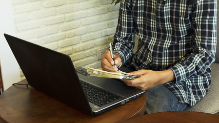 Hipster men sitting on the desk with laptop at coffee cafe for lifestyle concept backgrounds