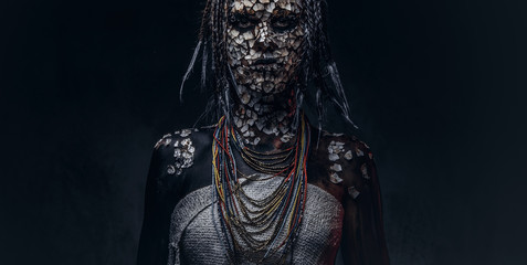 Close-up portrait of a witch from the indigenous African tribe, wearing traditional costume....