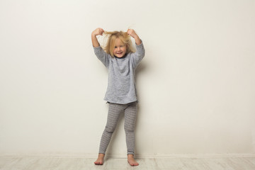 Full-length portrait of cute happy little girl