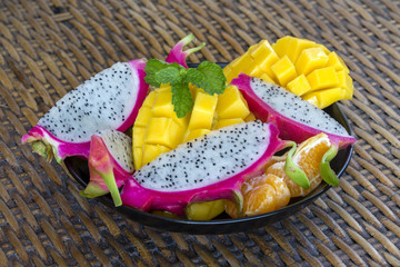 Fresh tropical fruit in plate - healthy breakfast, weight loss concept. Thailand