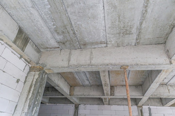 building under construction with iron steel support concrete beams