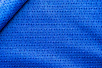 Fototapeta premium Blue color fabric sport clothing football jersey with air mesh texture background
