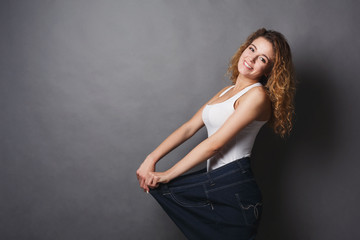 Woman wearing jeans much bigger size