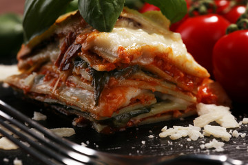 Serving of spicy traditional Italian beef lasagne in a restaurant