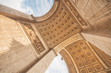 The Arc de Triomphe in paris, seen from below - obrazy, fototapety, plakaty