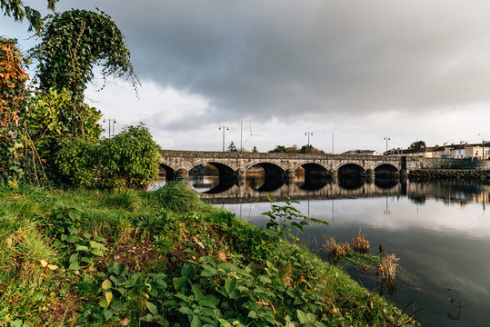 Beautiful bridge and reflections on river at morning