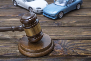 hammer of the judge. two collided cars. The concept of liability for traffic violations. Accident,...