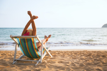 Obraz premium Woman on beach in summer