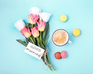 Good morning concept. Flowers and coffee top view.