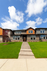 Fototapeta premium Concrete Steps to New Townhome Entrance
