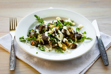Mushrooms morel with sour cream sauce.  Exquisite dish. (Morchella Esculenta)