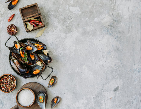  Mussels in wine with parsley and lemon. Seafood concept . Top view, flat lay, copy space