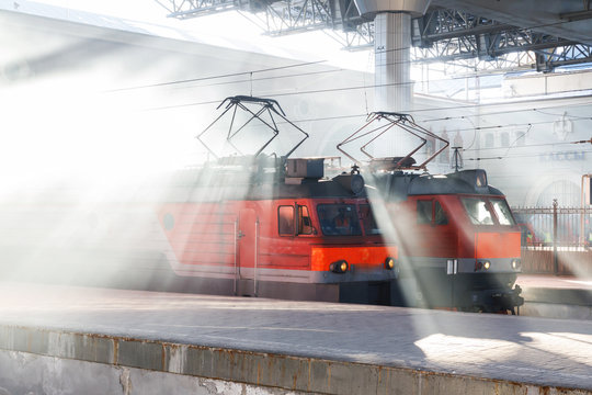 Electric train at the Moscow railway station in the rays of the sun on a frosty morning