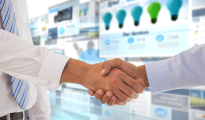 Close-up shot of a handshake in office against screen collage showing business advertisement