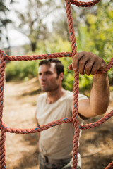Military soldier standing near fitness trial