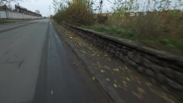 Walking bike in an industrial area on outskirts of urban city