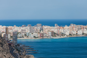 Landscape view from the top of the Castle of Santa Barbara in the background the beaches of the beautiful city of Alicante, Spain