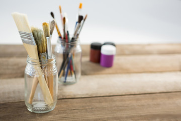 Various paintbrush in glass jar