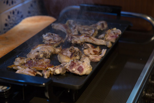 Grilled lamb chops on the grill in the kitchen. 