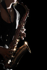 Obraz premium Saxophone Player Saxophonist playing jazz music. Sax player