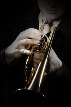 Trumpet player. Trumpeter playing jazz instrument