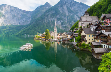 Scenic picture-postcard view of famous Hallstatt mountain village in the Austrian Alps with...