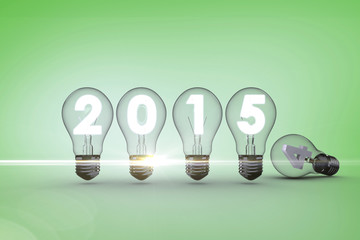 2015 with light bulb against green vignette